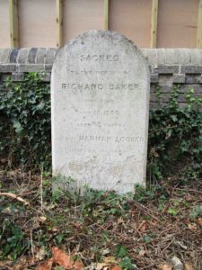 The headstone has suffered some erosion at the base.