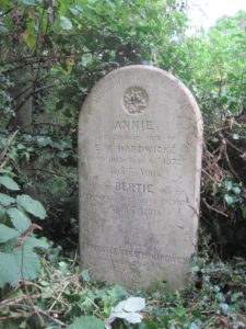 The west face of the headstone faces the western path and is well preserved. The reverse has not yet been uncovered. Photo 2016