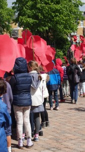 Parading the poppies from school to the Cemetery